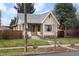 Charming brick home with a well-maintained front yard and inviting entryway at 2644 N Glencoe St, Denver, CO 80207