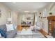 Bright and open living space with hardwood floors, neutral tones, and a dining area at 2644 N Glencoe St, Denver, CO 80207