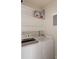 Laundry room with washer, dryer, and extra storage shelving at 7431 Singing Hills Dr # D7431, Boulder, CO 80301