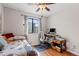 Cozy bedroom setup with a bed, desk, and chair by the window, perfect for a home office at 2800 Kalmia Ave # B209, Boulder, CO 80301