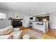 Living area with a fireplace, television, and a view into the kitchen at 2800 Kalmia Ave # B209, Boulder, CO 80301