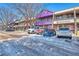 Commercial building exterior displaying retail shops, parking, and pedestrian access highlighting shopping and business within the community at 2800 Kalmia Ave # B209, Boulder, CO 80301