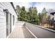 Outdoor balcony perfect for relaxation with views of lush greenery and a patio at 5810 W 39Th Pl, Wheat Ridge, CO 80212
