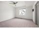 Bright bedroom with a neutral color scheme, plush carpet, and a ceiling fan at 5810 W 39Th Pl, Wheat Ridge, CO 80212