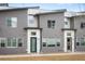 Modern two-story home featuring contemporary gray siding, white trim, and minimalist landscaping at 5810 W 39Th Pl, Wheat Ridge, CO 80212