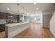 Modern kitchen with a large island, stainless steel appliances, and ample natural light at 5810 W 39Th Pl, Wheat Ridge, CO 80212