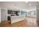 Modern kitchen featuring stainless steel appliances, an island, and sleek countertops at 5810 W 39Th Pl, Wheat Ridge, CO 80212