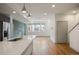 Modern kitchen with stainless steel appliances and an open concept living area at 5810 W 39Th Pl, Wheat Ridge, CO 80212