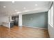 Open-concept living space featuring modern kitchen with stainless appliances and natural light at 5810 W 39Th Pl, Wheat Ridge, CO 80212