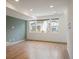 Bright and airy living room featuring hardwood floors and large windows at 5810 W 39Th Pl, Wheat Ridge, CO 80212