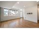 Bright living room with hardwood floors, recessed lighting, and multiple windows at 5810 W 39Th Pl, Wheat Ridge, CO 80212