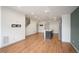 Open-concept living space with wood floors and a modern kitchen island at 5810 W 39Th Pl, Wheat Ridge, CO 80212
