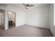 Bright main bedroom showcasing an ensuite bathroom and comfortable carpeting at 5810 W 39Th Pl, Wheat Ridge, CO 80212