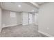 Finished basement area with neutral walls at 7076 S Newland St, Littleton, CO 80128