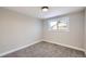 Bright bedroom with neutral walls and carpet at 7076 S Newland St, Littleton, CO 80128