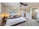 Bright bedroom with a walk-in closet and en-suite bathroom at 7076 S Newland St, Littleton, CO 80128