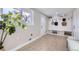 Laundry room with built-in shelving and bench at 7076 S Newland St, Littleton, CO 80128