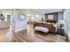 Open living area with hardwood floors, stylish furniture, and a fireplace at 7076 S Newland St, Littleton, CO 80128