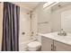 A bathroom featuring a shower and bath and a single sink at 2247 S Lima Ct, Aurora, CO 80014