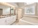 Bathroom featuring a shower, bath and double sinks at 2247 S Lima Ct, Aurora, CO 80014