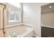 Bathroom featuring a bath and a window at 2247 S Lima Ct, Aurora, CO 80014