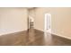 Spacious bedroom featuring an open doorway to the hall and beautiful hardwood floors at 2247 S Lima Ct, Aurora, CO 80014