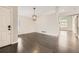 Living room with hardwood floors, gray walls, white trim and architectural features and modern lighting at 2247 S Lima Ct, Aurora, CO 80014