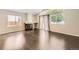 An open floor plan living room features hardwood floors, a fireplace, and plenty of natural light at 2247 S Lima Ct, Aurora, CO 80014