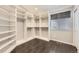 A large walk-in closet with custom shelving and hardwood floors at 2247 S Lima Ct, Aurora, CO 80014