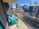 Enjoy stunning city views from the balcony with vibrant blue patio seating at 1020 15Th St # 17K, Denver, CO 80202