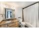 Bathroom featuring a tiled shower and a wood vanity with plenty of storage at 1020 15Th St # 17K, Denver, CO 80202