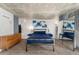 Bedroom with a blue bed, concrete ceilings, and sliding mirrored wardrobe at 1020 15Th St # 17K, Denver, CO 80202