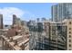 A rooftop view of the city skyline with buildings and traffic below on a clear day in a modern setting at 1020 15Th St # 17K, Denver, CO 80202