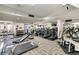 A fitness center with various exercise machines, weights, and mirrors for residents at 1020 15Th St # 17K, Denver, CO 80202