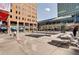 Outdoor plaza with restaurants, seating areas, and a water feature at 1020 15Th St # 17K, Denver, CO 80202