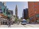 Downtown street view featuring the clock tower with people walking on the sidewalk at 1020 15Th St # 17K, Denver, CO 80202