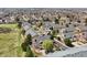 A picturesque neighborhood featuring well-maintained townhomes with lush green trees and lawn landscaping at 6701 W Yale Ave, Lakewood, CO 80227