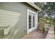 Private balcony featuring a seating area, scenic views, and access from the home's interior at 6701 W Yale Ave, Lakewood, CO 80227