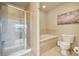 Relax in this bathroom complete with tub, shower, and a picturesque window view at 6701 W Yale Ave, Lakewood, CO 80227