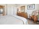Comfortable bedroom with natural light, a dresser, and ample closet space at 6701 W Yale Ave, Lakewood, CO 80227
