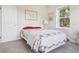 Cozy bedroom with a quaint quilt, soft natural light, and fresh white walls at 6701 W Yale Ave, Lakewood, CO 80227