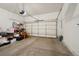 Spacious two car garage with ample storage space and a clean, uncluttered floor at 6701 W Yale Ave, Lakewood, CO 80227
