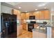 Modern kitchen featuring stainless steel appliances and granite countertops at 6701 W Yale Ave, Lakewood, CO 80227