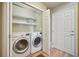 This laundry room has side-by-side washer and dryer for efficient chore completion at 6701 W Yale Ave, Lakewood, CO 80227