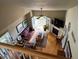 View of living room featuring fireplace, outdoor access, ceiling fan, and abundant natural light at 6701 W Yale Ave, Lakewood, CO 80227