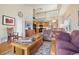 Bright, open living room with hardwood floors and access to the kitchen and upper level at 6701 W Yale Ave, Lakewood, CO 80227