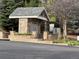 Community mailboxes are set in a stone structure surrounded by manicured landscaping at 6701 W Yale Ave, Lakewood, CO 80227