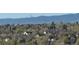 Scenic view of the neighborhood with lush trees and mountain backdrop at 6701 W Yale Ave, Lakewood, CO 80227
