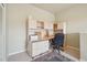The functional office area features a built-in desk, ample storage, and carpeted flooring at 6701 W Yale Ave, Lakewood, CO 80227