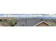 Panoramic view of rooftops and the surrounding landscape highlights the home's location at 6701 W Yale Ave, Lakewood, CO 80227